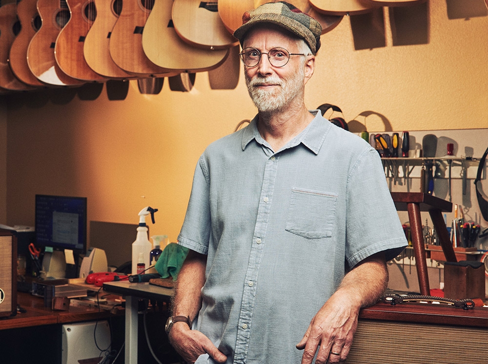 David Judd leaning against counter looking into camera