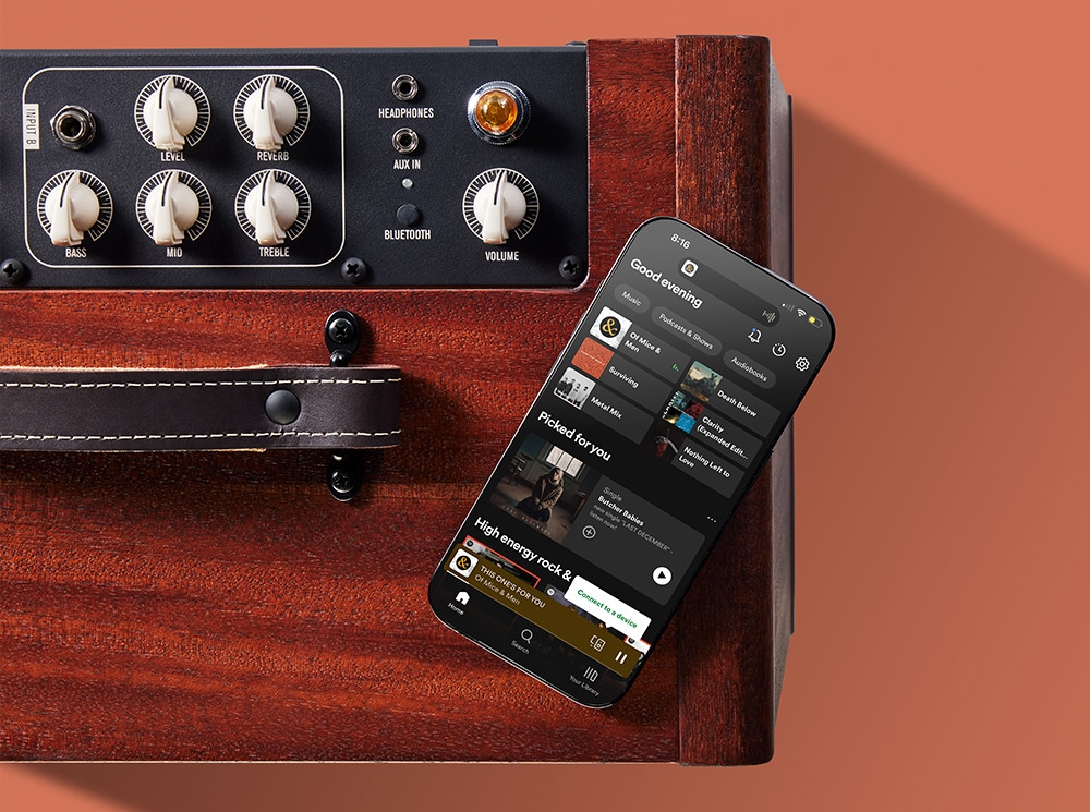 iPhone sitting on top of amp tuned to Spotify