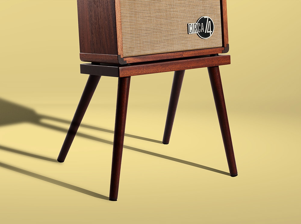 Amp on stand on yellow background