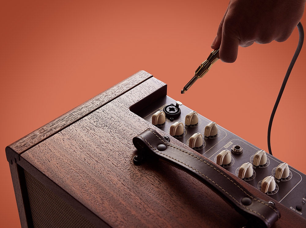 Amp on orange plain background